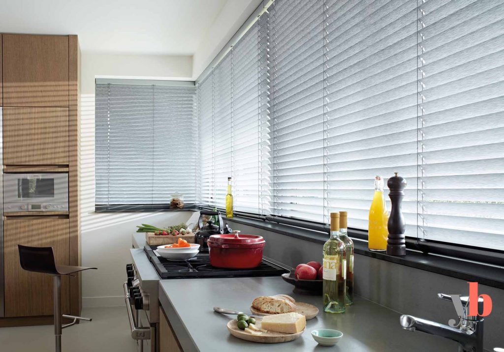 Grey Venetian blinds in kitchen