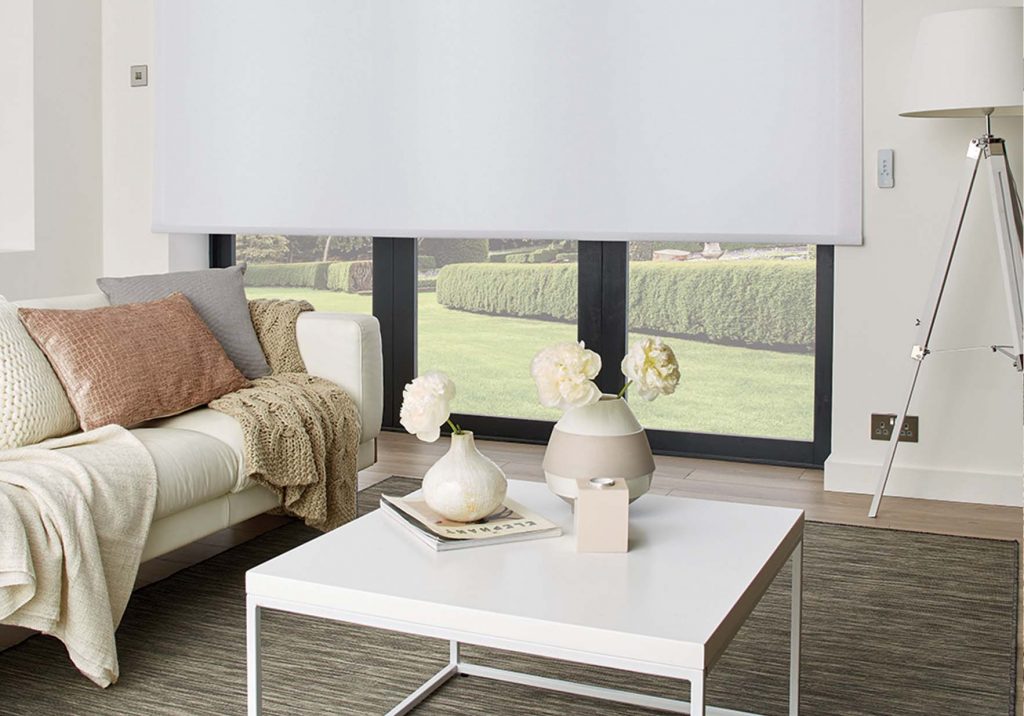 Living room with white roller blind