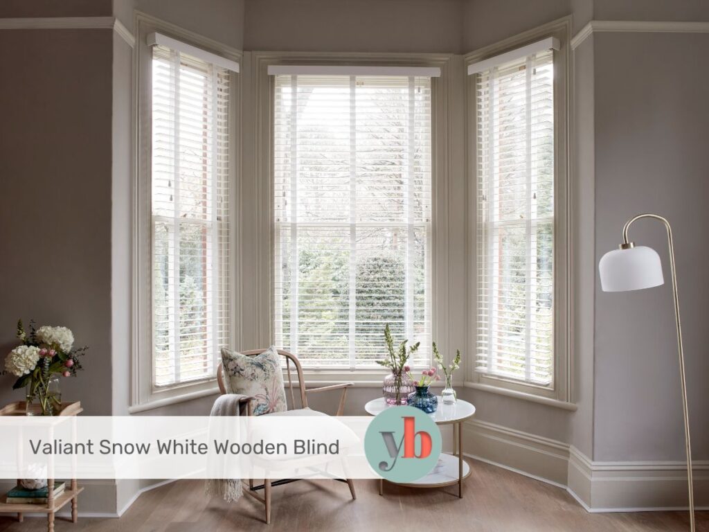 white wooden blinds in bay window
