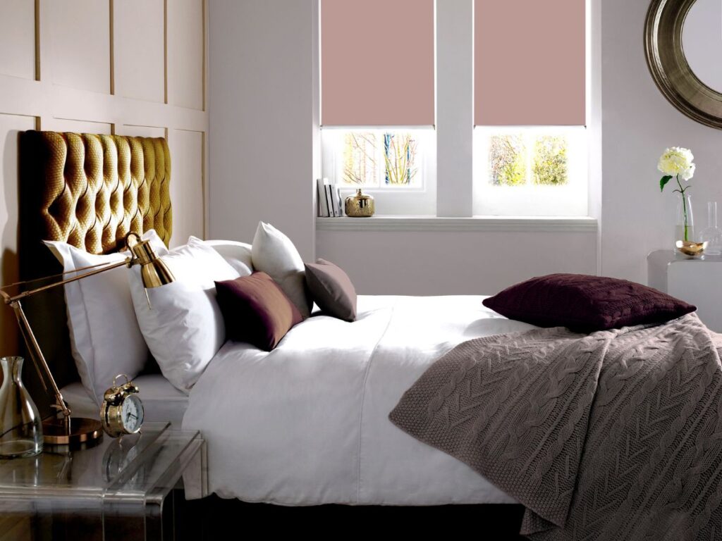 pink roller blinds in bedroom