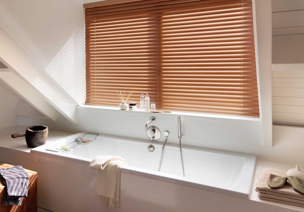 faux wood blinds in a bathroom by Your Blinds Direct