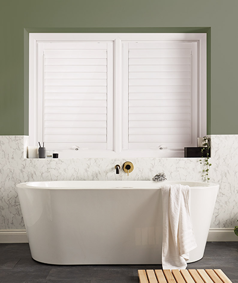 Louvolite Perfect Fit Lite Shutters in the closed position in a bathroom